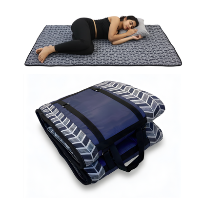 Woman lying on a fitmat foldable mat with a fitmat foldable mattress below on a white background