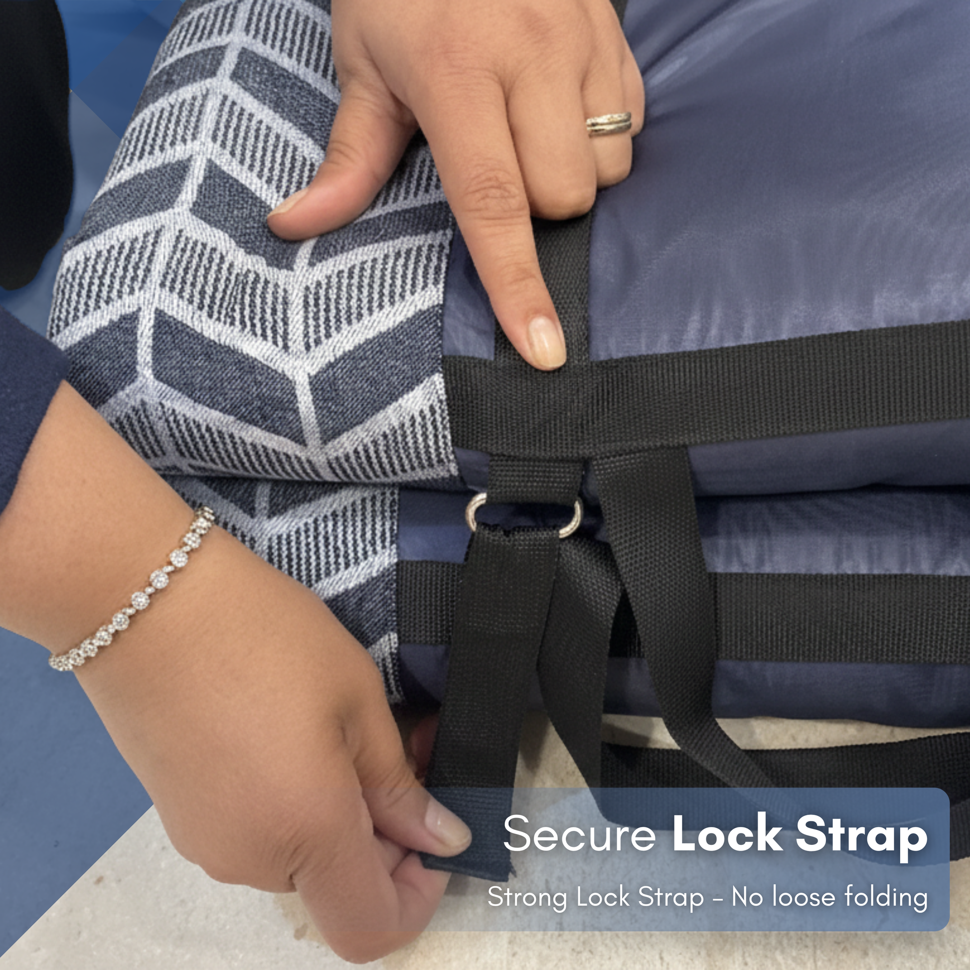 Person securing a lock strap on fitmat foldable mattress  with text indicating 'Secure Lock Strap' and 'Strong Lock Strap - No loose folding'.