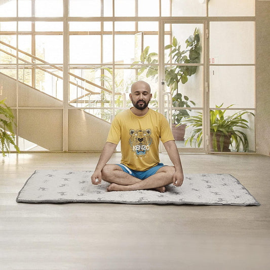 man sitting on slim mattress